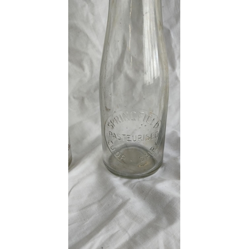 465 - Two vintage milk bottles 'Bernagh Dairy - R Hazelton, Dungannon' and 'Springfield Pasteurised Co-Op ... 