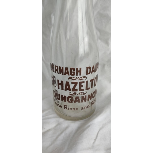 465 - Two vintage milk bottles 'Bernagh Dairy - R Hazelton, Dungannon' and 'Springfield Pasteurised Co-Op ... 