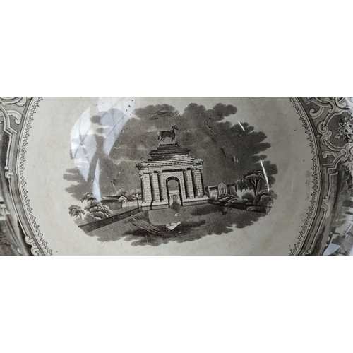 491 - An antique pottery bowl with transfer print of Wellington Arch (a/f).