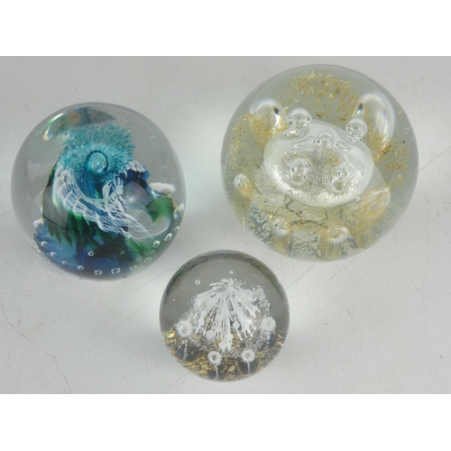 14 - A large vintage Irish Jerpoint Glass Studio paperweight and two others.