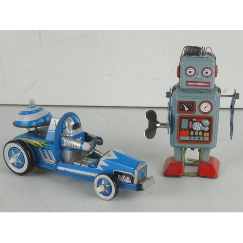 27 - A vintage tin car with spaceman driver and a tin robot.