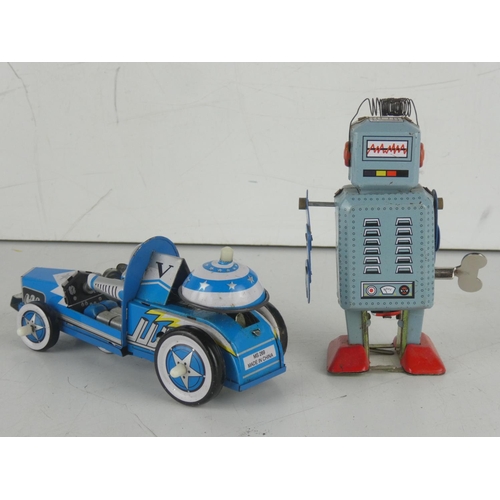 27 - A vintage tin car with spaceman driver and a tin robot.