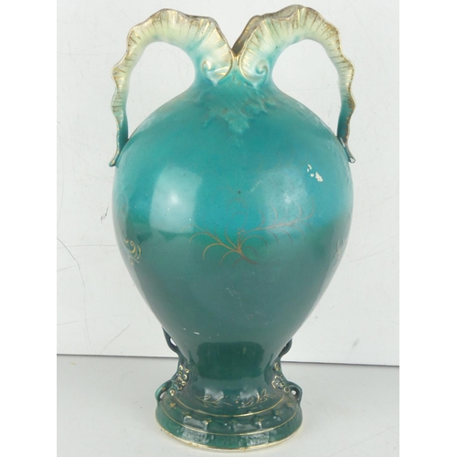 39 - An antique two handled vase decorated with a floral pattern.