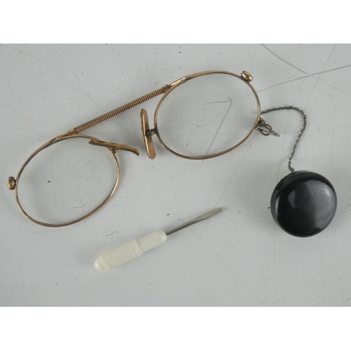 44 - A pair of antique reading glasses in case.