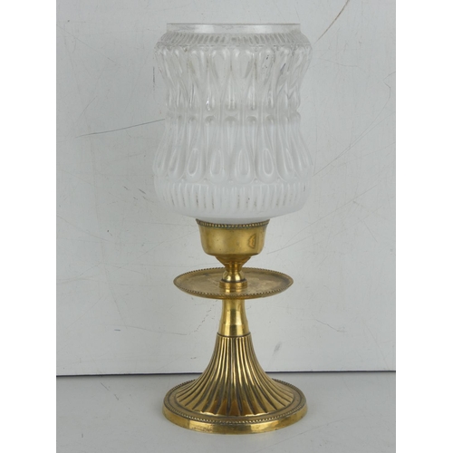 47 - A vintage brass based candleholder with frosted and clear glass shade.