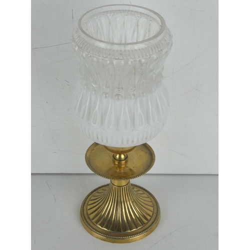 47 - A vintage brass based candleholder with frosted and clear glass shade.