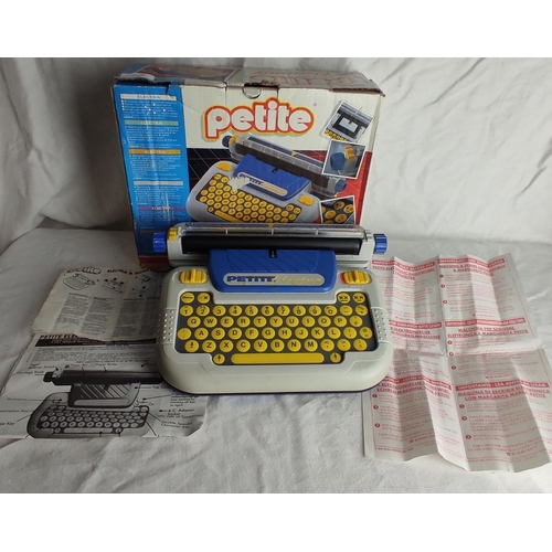 55 - A vintage boxed Petite child's typewriter.