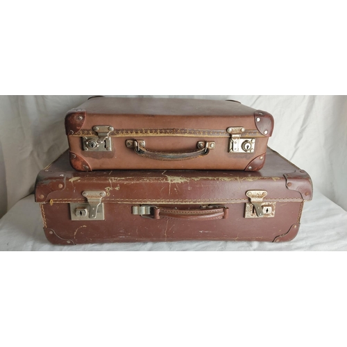 56 - Two vintage leather suitcases.