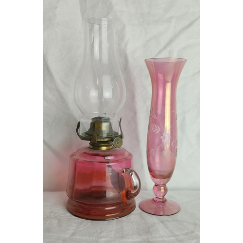 63 - An antique ruby glass finger lamp & vase.