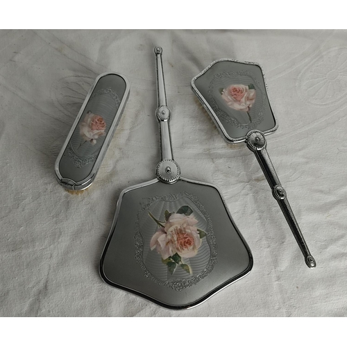 74 - A vintage three piece dressing table set.