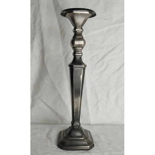 81 - A large metal candlestick.