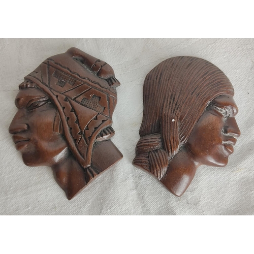 94 - A pair of vintage carved wall masks.