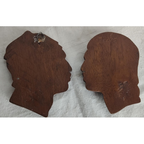 94 - A pair of vintage carved wall masks.