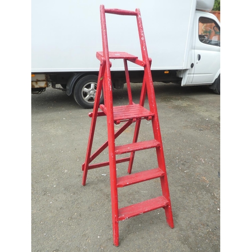 100 - A vintage folding wooden ladder.