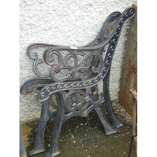 106 - A pair of cast iron garden seat ends.