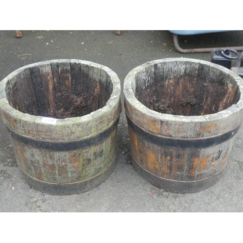 108 - A pair of wooden barrel planters.