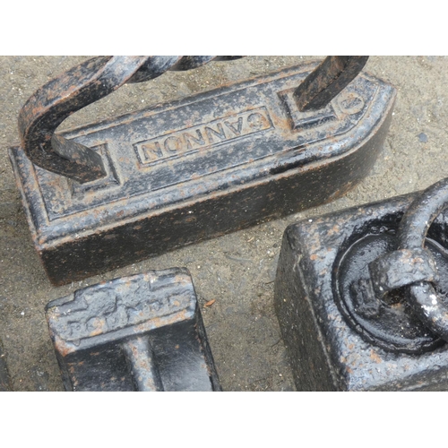 109 - An antique 'Cannon' cast iron, two 14lb cast iron weights and more.