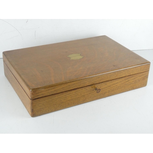 123 - An antique oak canteen of cutlery box and a large lot of assorted costume jewellery.