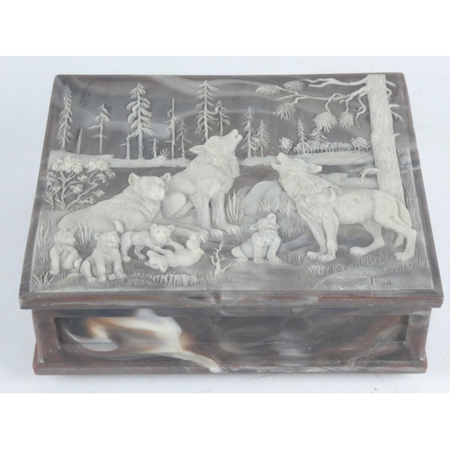 128 - An unusual carved jewellery box, signed.