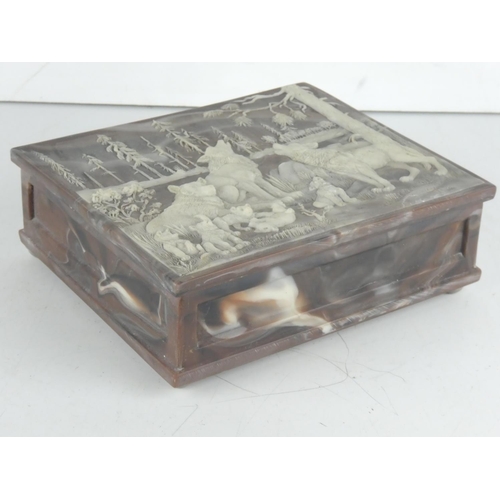 128 - An unusual carved jewellery box, signed.