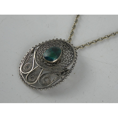 140 - A Sterling silver necklace and pendant.