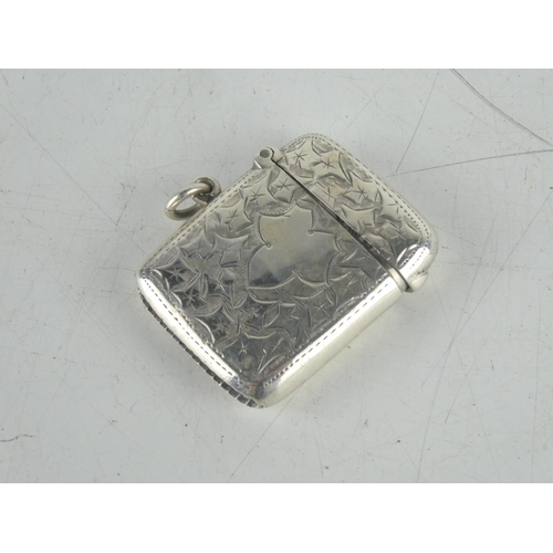 156 - A Sterling silver engraved vesta case.