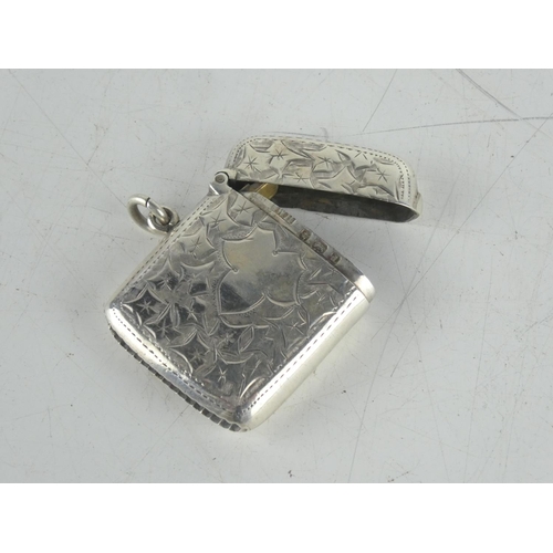 156 - A Sterling silver engraved vesta case.