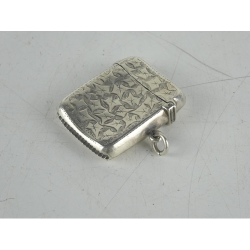 156 - A Sterling silver engraved vesta case.