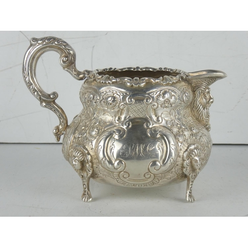 163 - A superb & highly decorative Irish silver jug produced by West & Son. Weighing 377.5 grams.