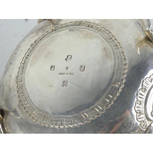 163 - A superb & highly decorative Irish silver jug produced by West & Son. Weighing 377.5 grams.