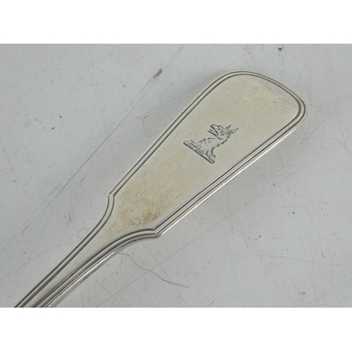 180 - An antique Irish silver serving spoon by maker James England, Dublin 1818, measures 23cm.