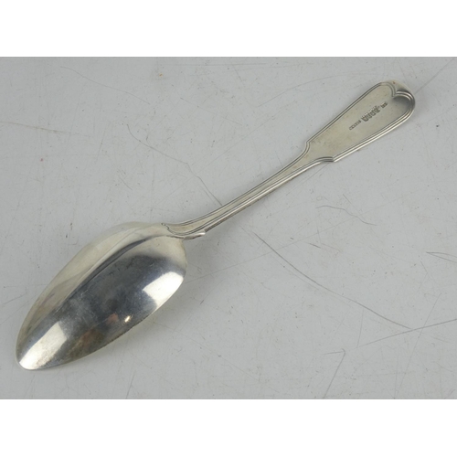 180 - An antique Irish silver serving spoon by maker James England, Dublin 1818, measures 23cm.