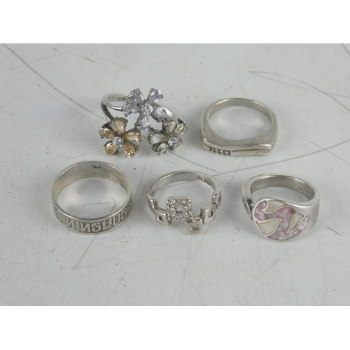 183 - Four Sterling silver dress rings and another.