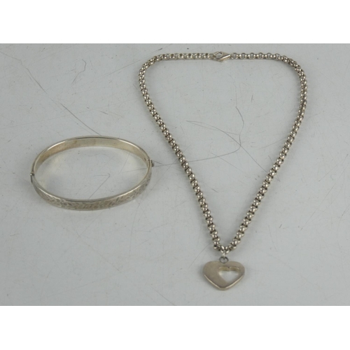 184 - A Sterling silver engraved bangle and  Sterling silver necklace.