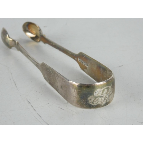 186 - A pair of Sterling silver sugar nips.