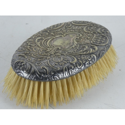 146 - A Sterling silver backed brush.