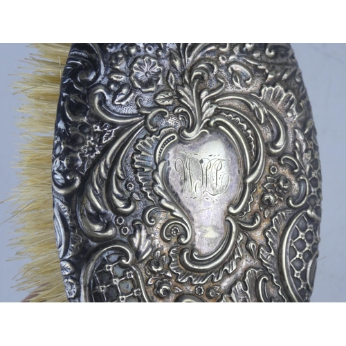 146 - A Sterling silver backed brush.