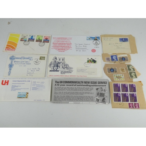 207 - A mixed lot of used postage stamps, Energy Post Office first day cover and more.