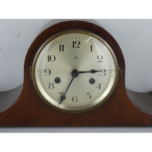 231 - A vintage wood cased mantle clock with scroll detail and two others.