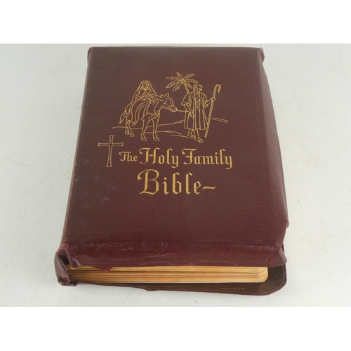 248 - A vintage leather bound Holy Family Bible with illustrations.