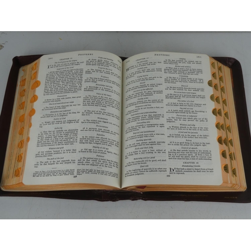 248 - A vintage leather bound Holy Family Bible with illustrations.