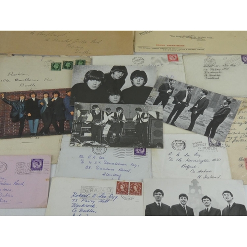 250 - A collection of vintage postcards of The Beatles, The Rolling Stone, used postage stamps, bank notes... 