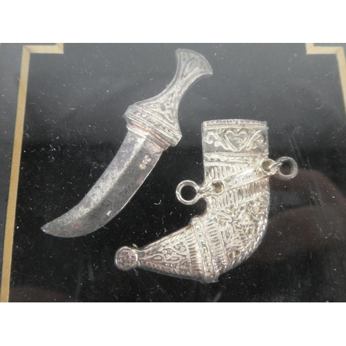 252 - A framed Sterling silver dagger and sheath.