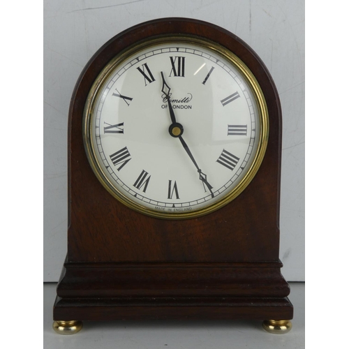 254 - A Comitti of London wooden cased mantle clock.