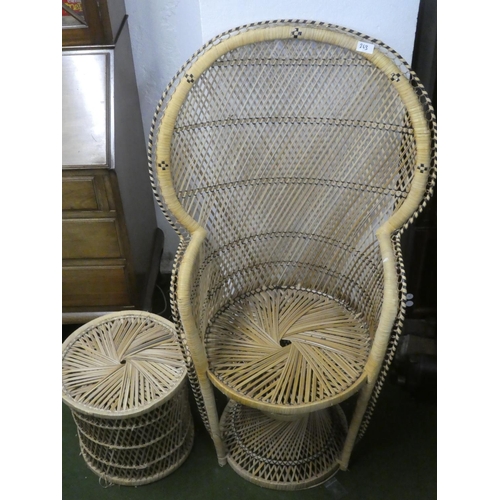 263 - A vintage rattan peacock style armchair and stool/table.