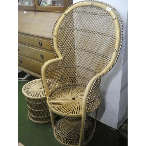 263 - A vintage rattan peacock style armchair and stool/table.