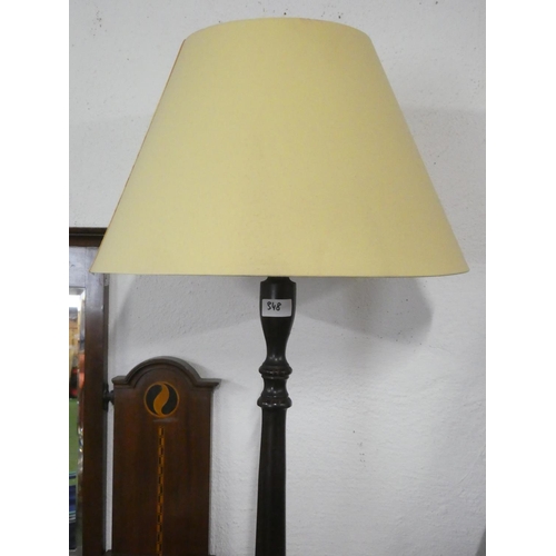 348 - A standard lamp with shade.