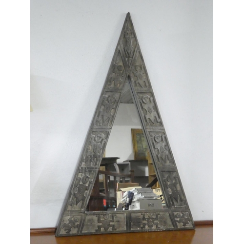 356 - A large triangular mirror with carved wooden frame.