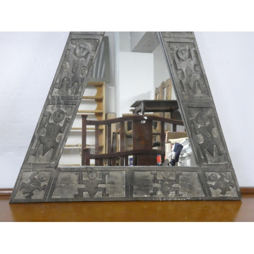 356 - A large triangular mirror with carved wooden frame.