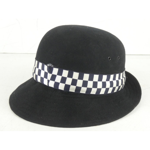 367 - A vintage police officers hat.